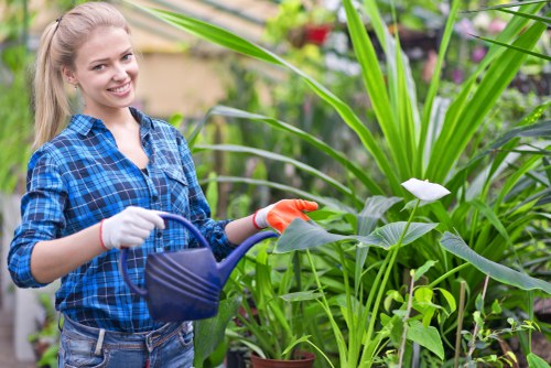 Team member preparing equipment at start of gardening job